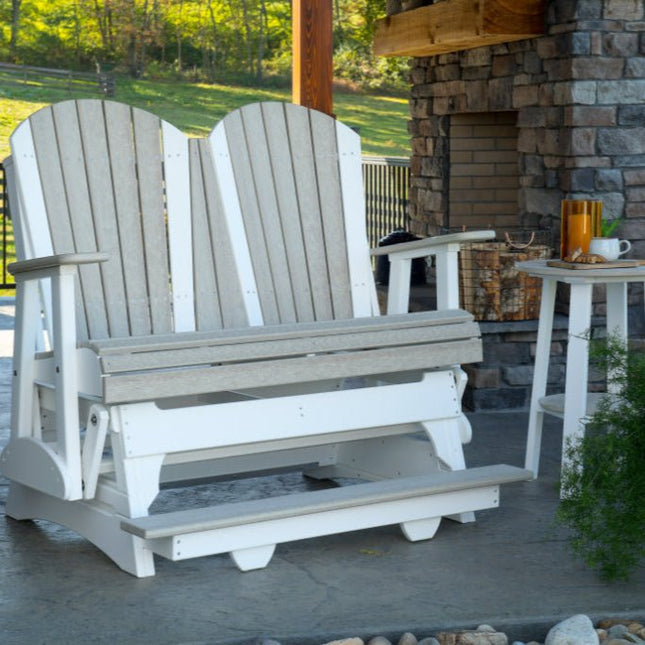 4 foot Adirondack Poly Balcony Glider Birch and White on patio with fireplace.