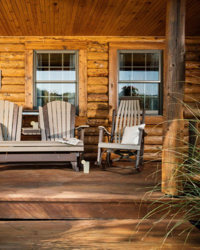 LuxCraft 5 foot adirondack glider weather wood and chestnut brown alongside LuxCraft grandpa's rocker