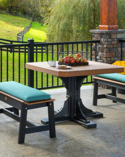 LuxCraft 41" square table featured with Antique Mahogany and Black and 41" Café Dining Bench and Bench Cushion in the Cast Breeze color.