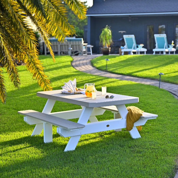 LuxCraft 6' Picnic Table featured in Birch and White with Lumien Nano Pathway Lighting and LuxCraft Lounge Chairs in Aruba Blue and White.