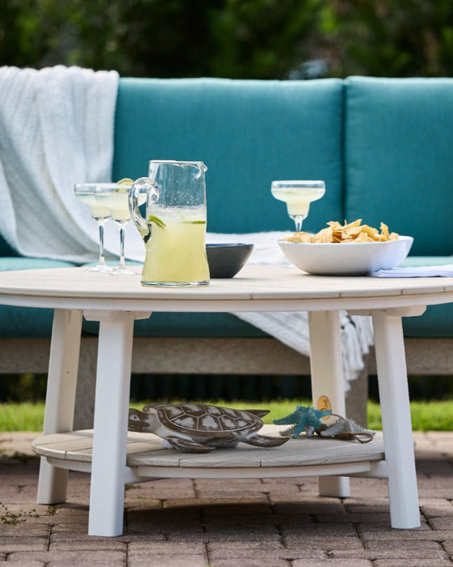 LuxCraft Deluxe Conversation Table featured in Birch and White with Lanai Deep Seating with Cast Breeze Cushions.